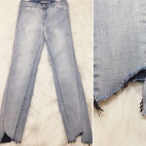 Tractr skinny jeans w/ an asymmetrical frayed hem